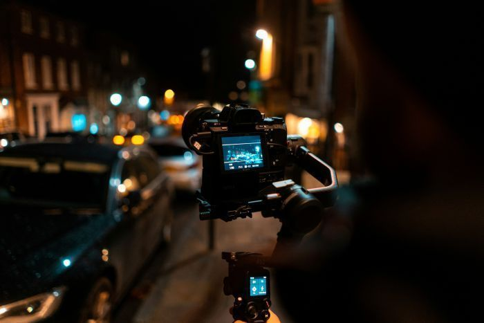 Expert Filming Street Scene at Night